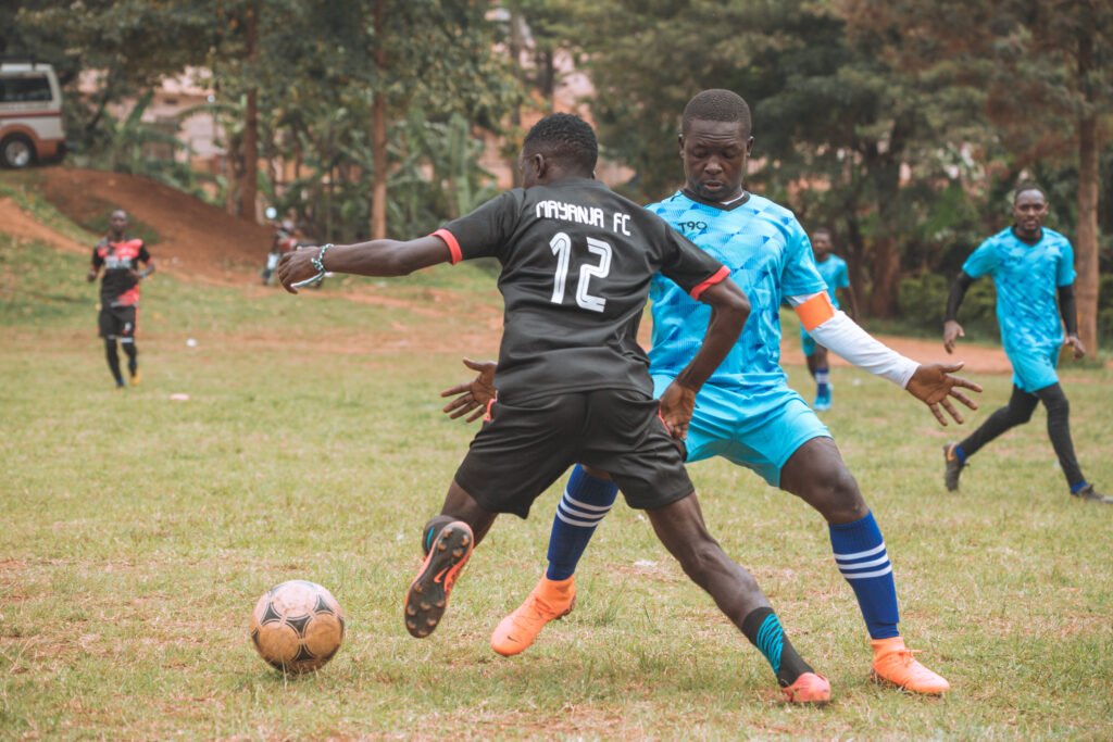 two footballers playing soccer